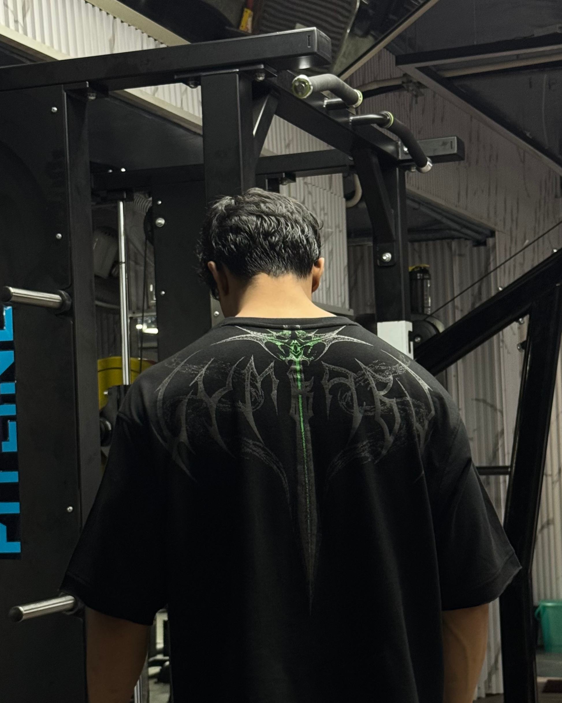 Person using a gym machine in a gym setting