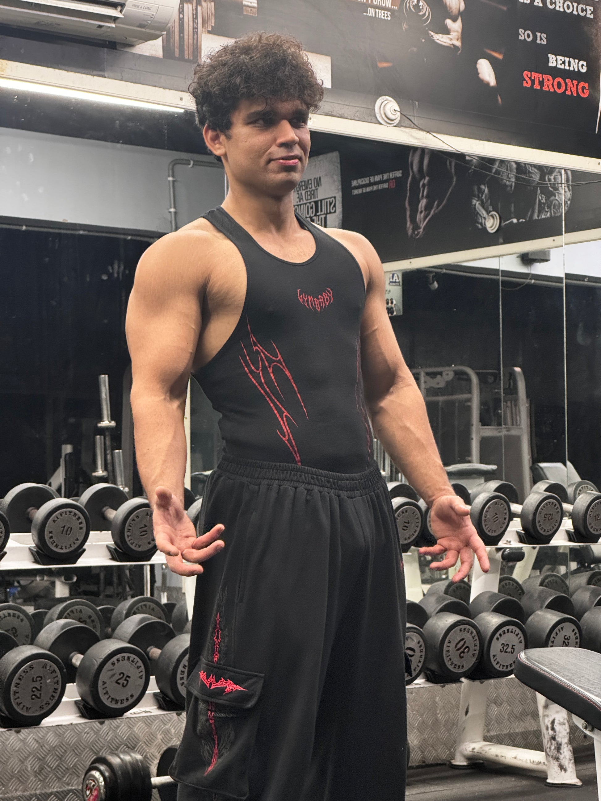 Person exercising with dumbbells in a gym setting